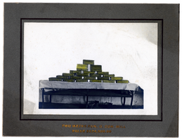 Photograph of gold bars stacked on table, Goldfield (Nev.), early 1900s