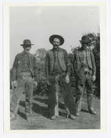 Photograph of three men wearing chaps, Nye County (Nev.), 1900-1925