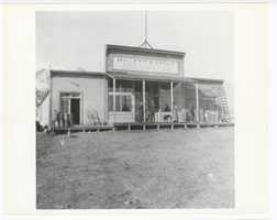 Photograph of a group on the porch of Millett's dry goods store in  Millett (Nev.), 1920