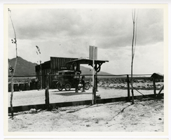 Photograph of an automobile in front of Garrett's General Store, Nyala (Nev.), 1900-1925