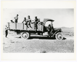 Photograph of men in the back of a pick-up for a scouting trip near Goldfield (Nev.), 1926