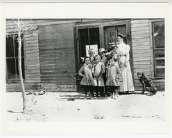 Photograph of a schoolteacher and students in front of the schoolhouse, Springdale (Nev.), 1908