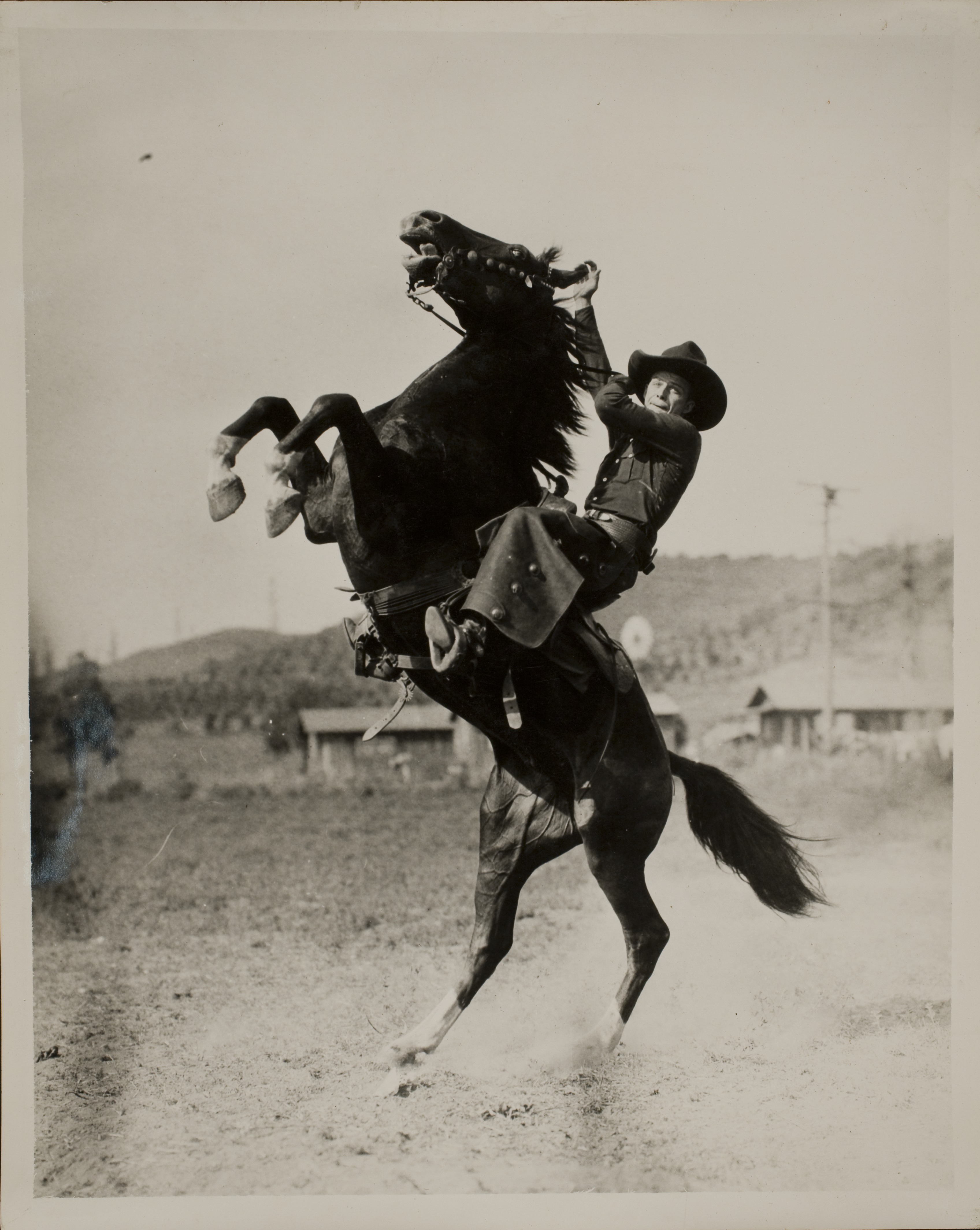 Rex Bell riding on a horse: photographic print