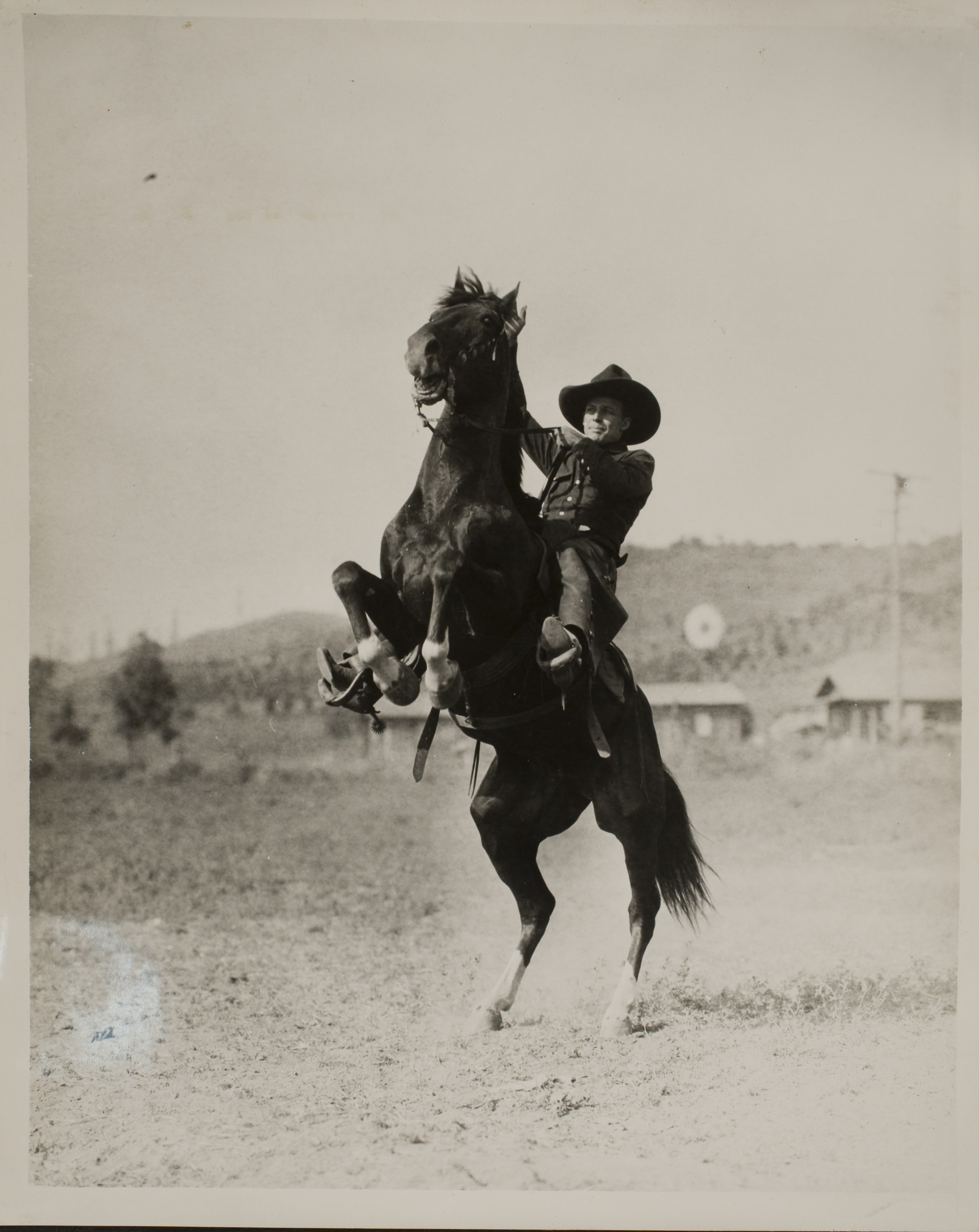 Rex Bell riding on a horse: photographic print