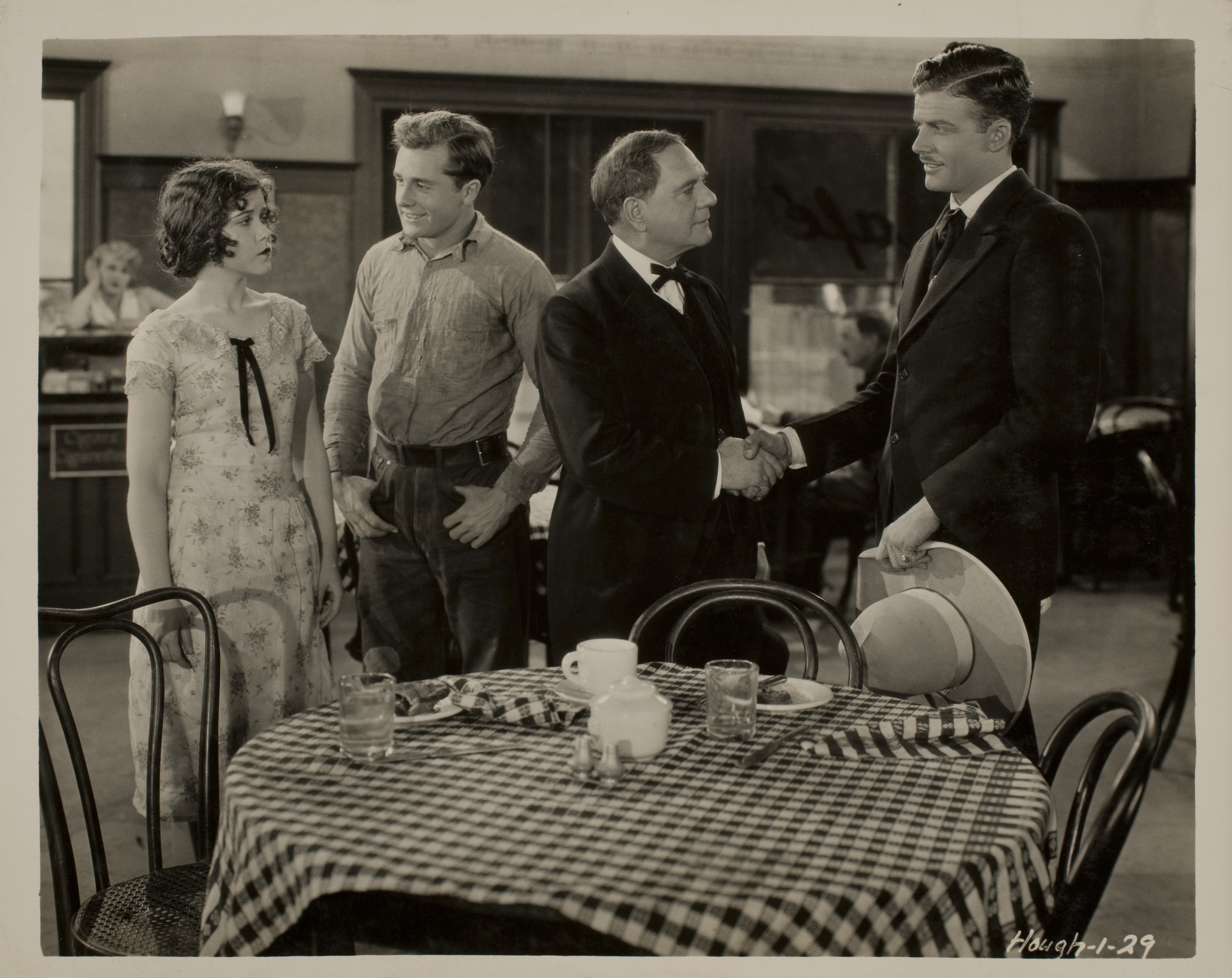 Movie still with Rex Bell (George Francis Beldam) (on right) and other unidentified people: photographic print