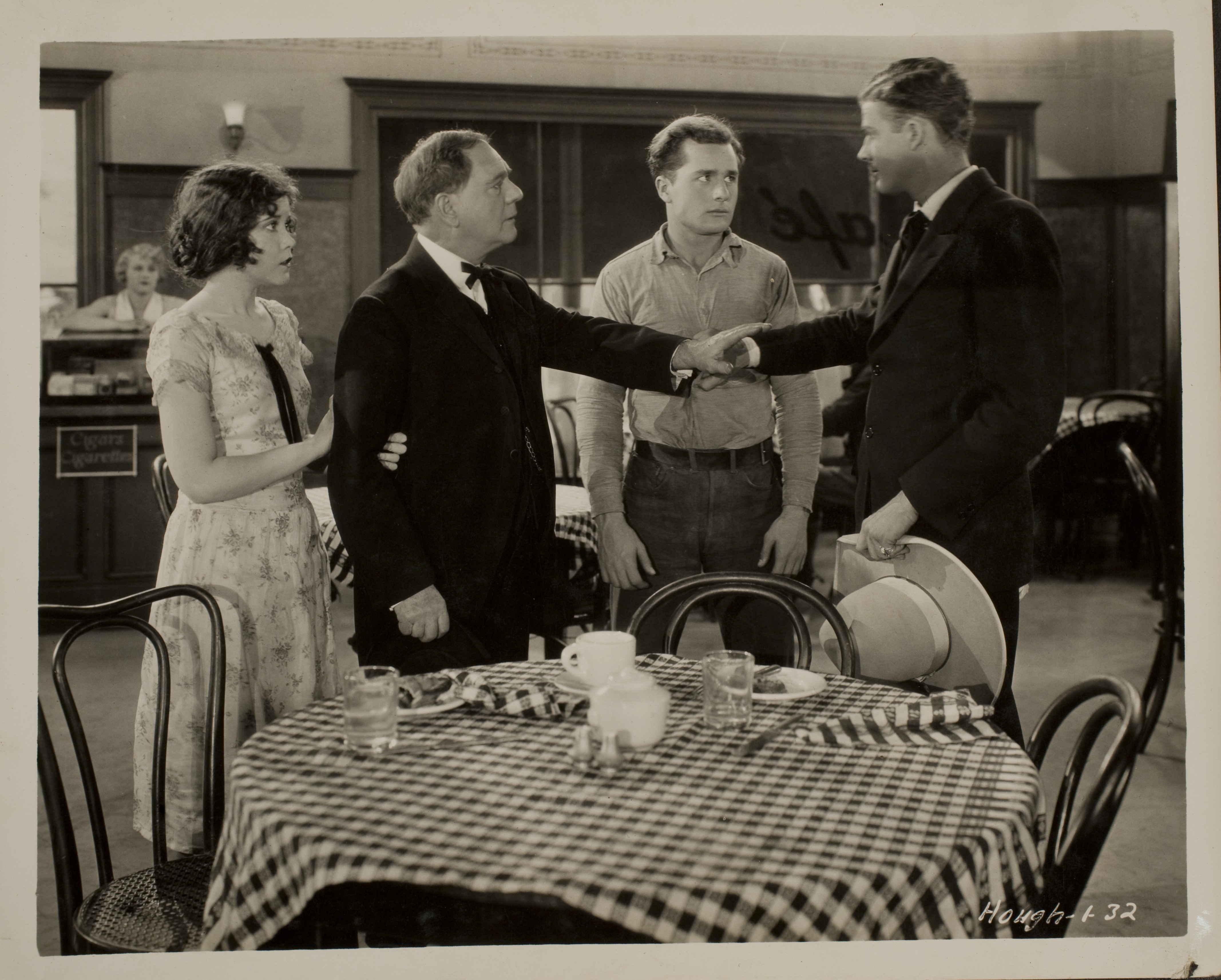 Movie still with Rex Bell (George Francis Beldam) (on right) and other unidentified people: photographic print
