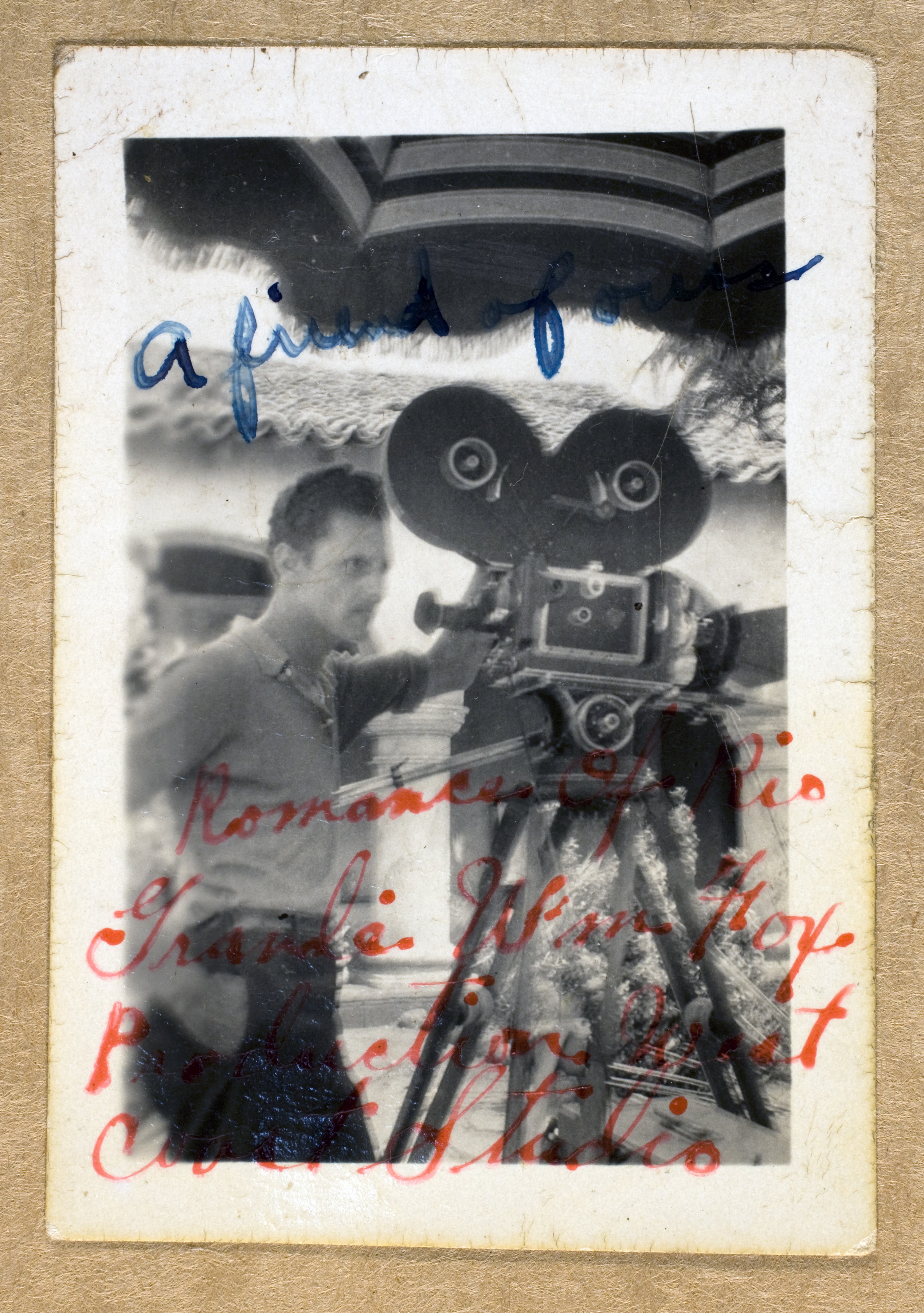 Unknown man at unknown location with movie camera.  Handwritten on photograph is "A friend of ours.  Romance of Rio Grande. W'm Fox Production West Coast Studio"