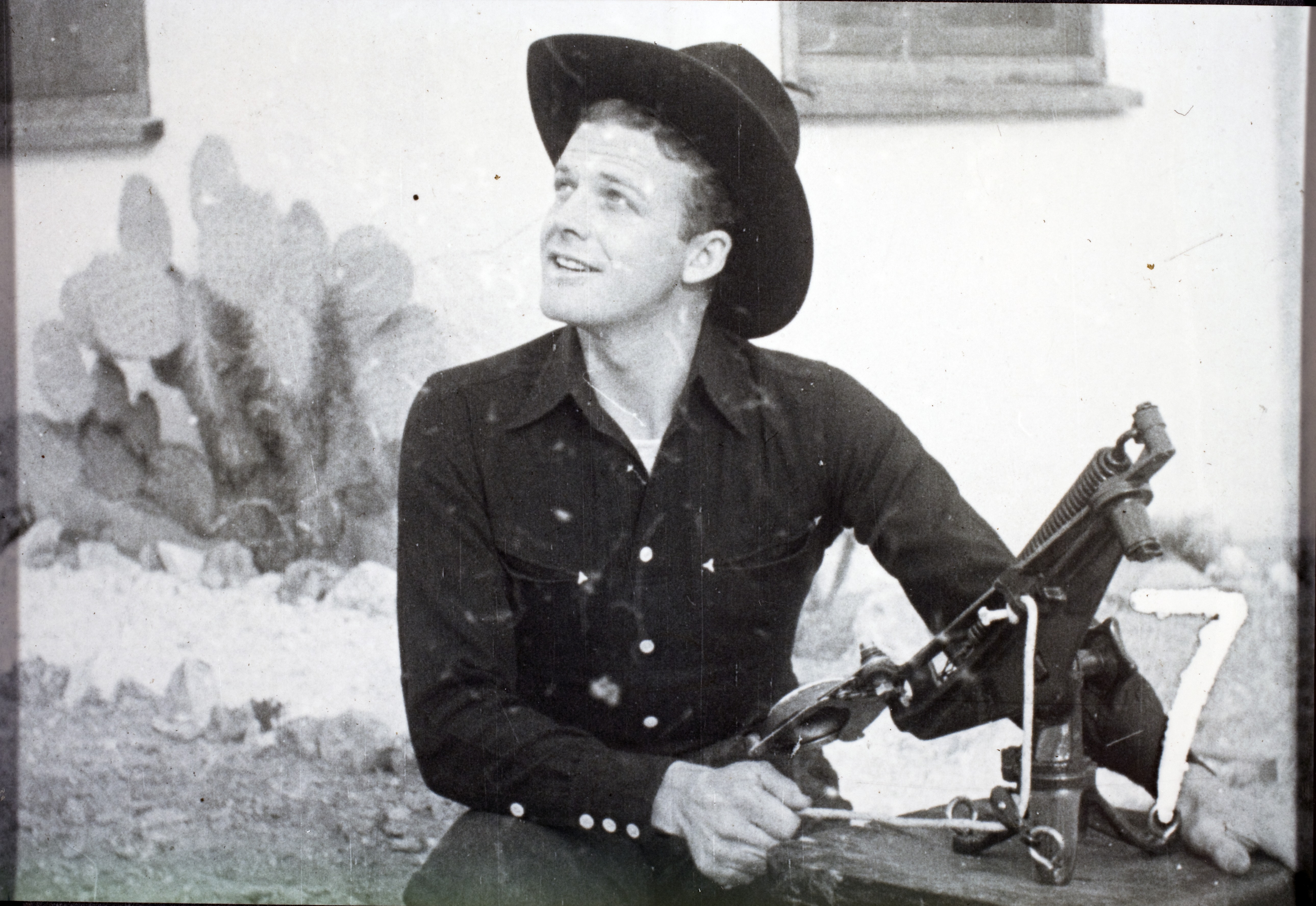 Rex Bell (George Francis Beldam) outside of ranch house at Walking Box Ranch, Nevada with skeet shooter: photographic print