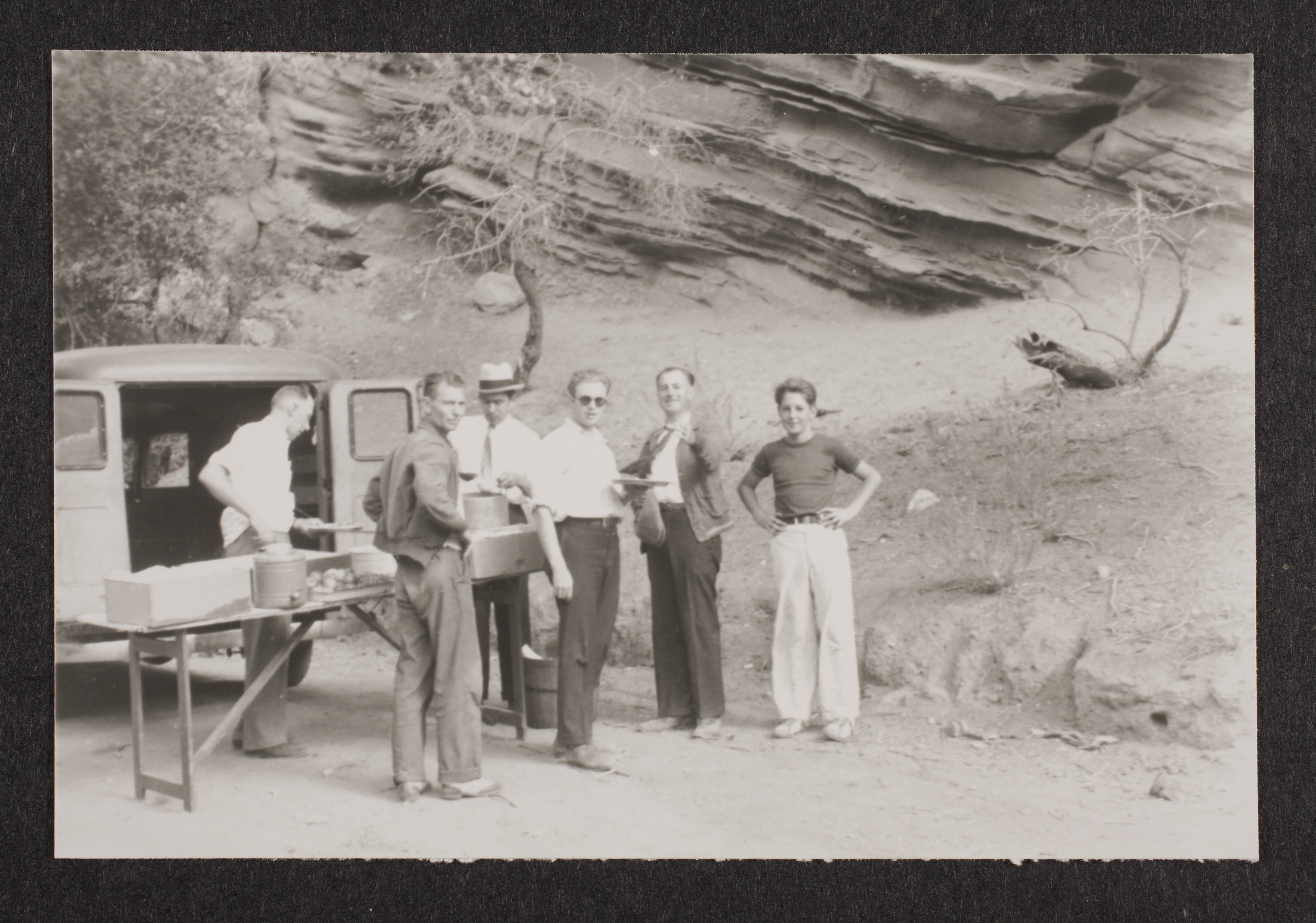 Unidentified men outside at unknown location: photographic print
