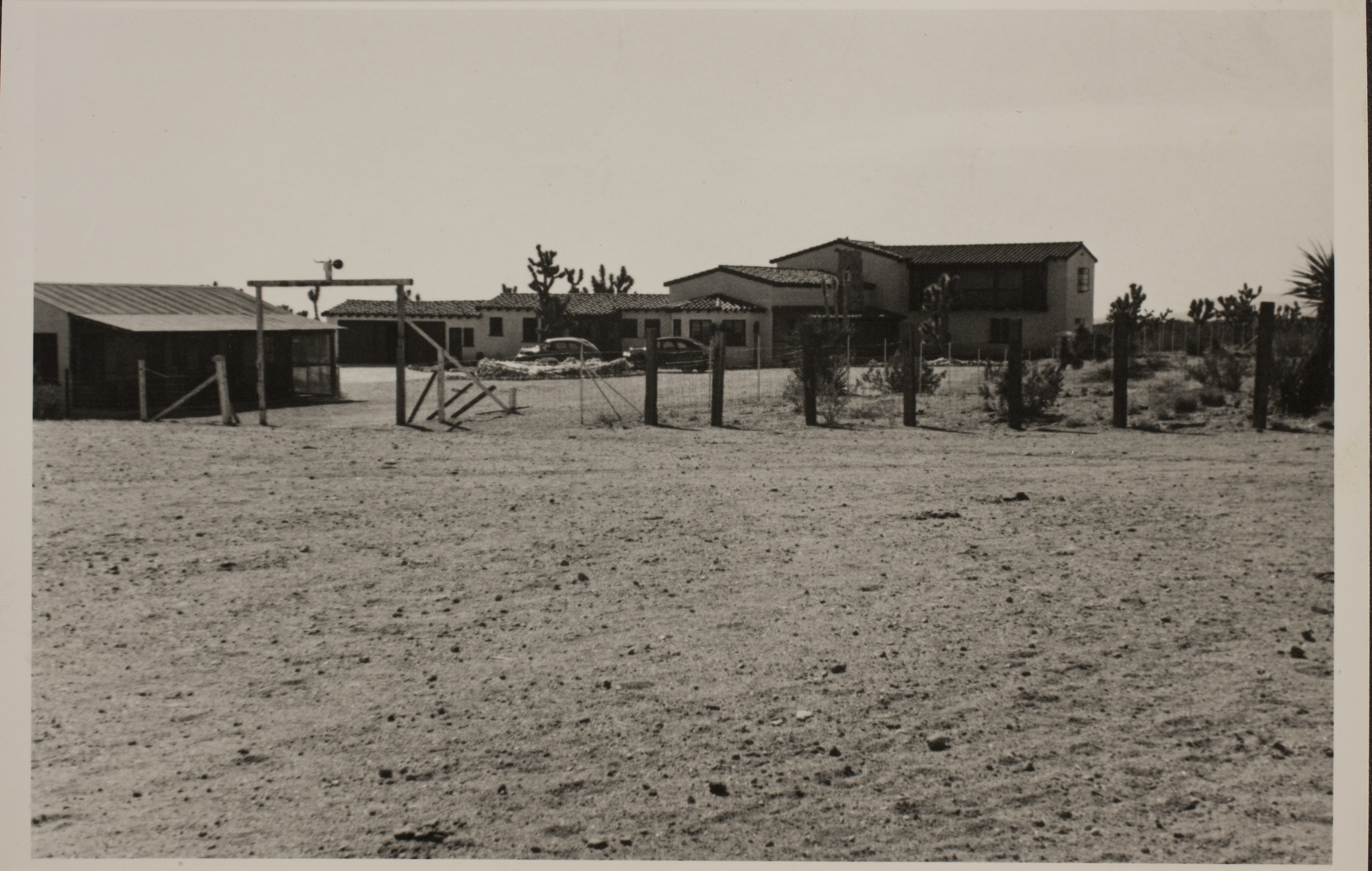 The Walking Box Ranch from the front gate.  The bunkhouse is visible on the left and the ranch house in the center: photographic print
