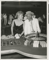 Photograph of Kim Novak and Jake Freedman at the roulette table, Sands Hotel, Las Vegas, circa late 1950s