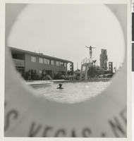 Photograph of the Sands Hotel pool, seen through a life preserver, Las Vegas, circa 1950s-1960s