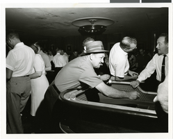 Photograph of gambler playing craps, Sands Casino, Las Vegas, circa 1955-1965