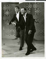 Photograph of Dean Martin and Frank Sinatra performing on an NBC television program, circa 1960s