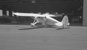 Film transparency of a hangar and airplane, Boulder City (Boulder Dam) Airport, circa 1930-1940