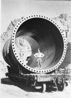 Film transparency of man standing inside pipe, Hoover Dam, circa 1930-1935