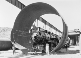 Film transparency of a locomotive inside a 30 foot diameter pipe, Hoover Dam, March 14, 1934