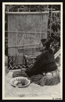 Photograph of a Navajo woman rug weaver, unidentified location, circa 1900-1950