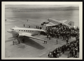 Photograph of people and TWA propeller airplanes on desert airfield, Boulder City, Nevada, circa 1930s