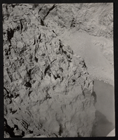 Photograph of workers scaling the high wall of Black Canyon, circa 1930-1935