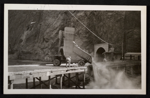 Photograph of truck dumping dirt into Colorado River for Hoover Dam cofferdam, circa 1930-1935