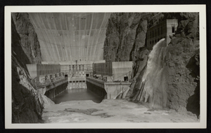 Photograph of powerhouses and downstream face of Hoover Dam from coffer dam, circa 1934-1935