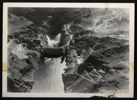 Aerial photograph of Hoover Dam with jet flow gates open, circa 1935-1936