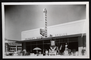 Photograph of people with picket signs in front of Cashman's automobile dealership, Las Vegas, circa 1940s