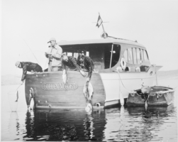 Film transparency of four men fishing off of a boat, Lake Mead, circa 1934-1950s