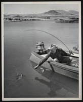 Photograph of man fishing on Lake Mead, circa late 1930s-1950s