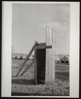 Photograph of an outhouse and tents, Henderson, Nevada, circa 1941