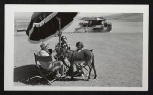 Photograph of burro and women near Hoover Dam, circa late 1930s