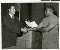 Photograph of a Sands Hotel employee receiving a certificate of merit, Las Vegas, October 3, 1968