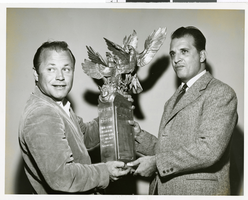 Photograph of Bill Muncey accepting a trophy from Bruno Torti, Las Vegas, November 1960