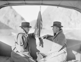 Film negative showing men on a boat on Lake Mead, January 1938