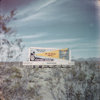 Film transparency showing a billboard in Boulder City, circa late 1930s-1940s