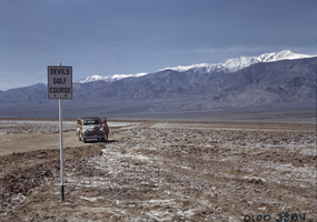 Film transparency of a woman at Devil's Golf Course, Death Valley, California, circa 1940s to 1950s