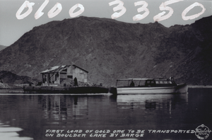 Film transparency of postcard showing a boat transporting gold ore on Lake Mead, circa late 1930s