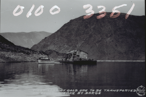 Film transparency of a postcard showing a boat transporting gold ore on Lake Mead, circa late 1930s