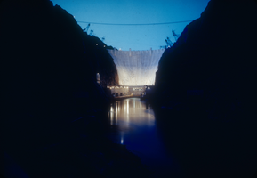 Slide of downstream face of Hoover Dam at dusk, circa late 1930s