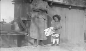Film transparency of a woman and child in Death Valley, Nevada, circa 1910s to 1920s