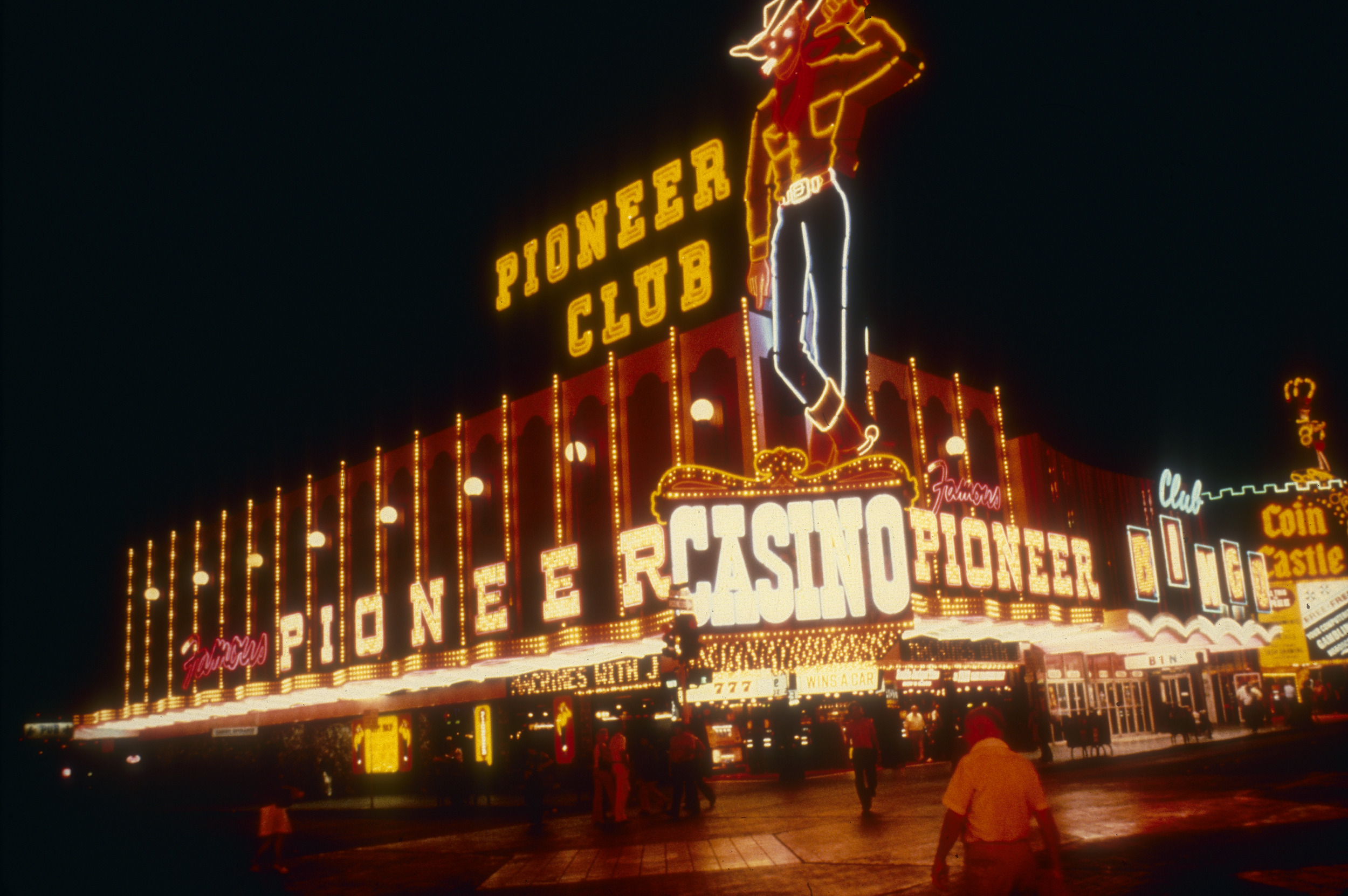 Slide of the Pioneer Club and its neon signs, including Vegas Vic, Las Vegas, circa 1980s