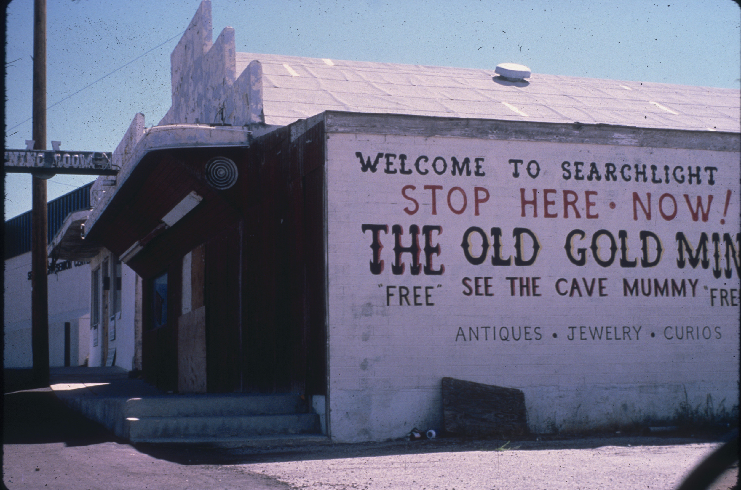 Slide of the exterior of an abandoned gift shop, Searchlight, Nevada, 1986
