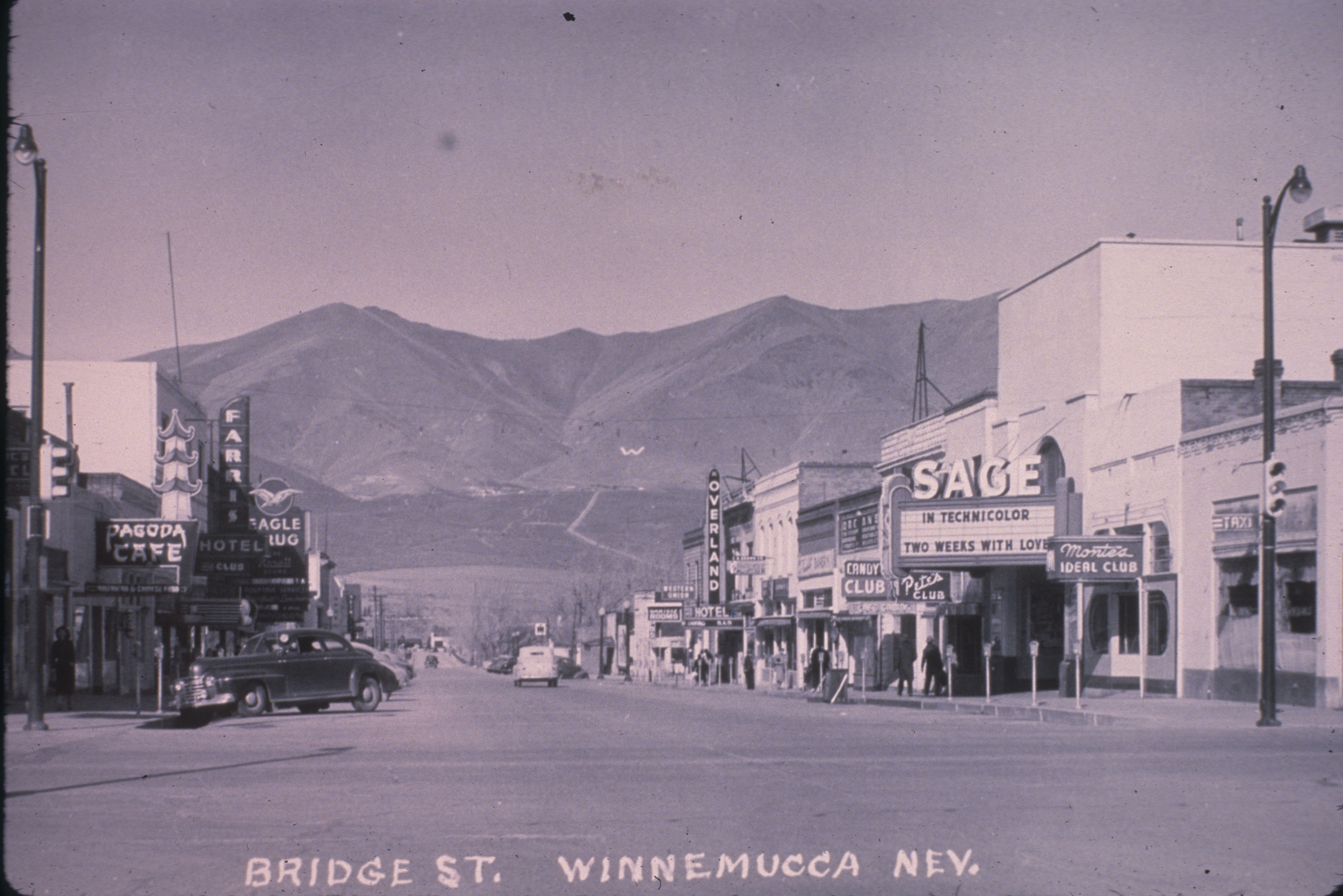 Slide of Bridge Street and its neon signs, Winnemucca, Nevada, circa 1930s