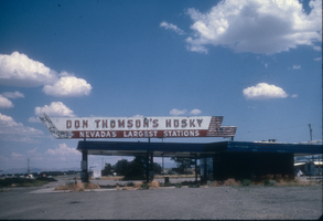 Slide of the defunct Don Thomson's Husky Station and its neon sign, Winnemucca, Nevada, 1986