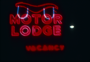 Slide of the neon sign for the Ox Bow Motor Lodge, Reno, Nevada, 1986
