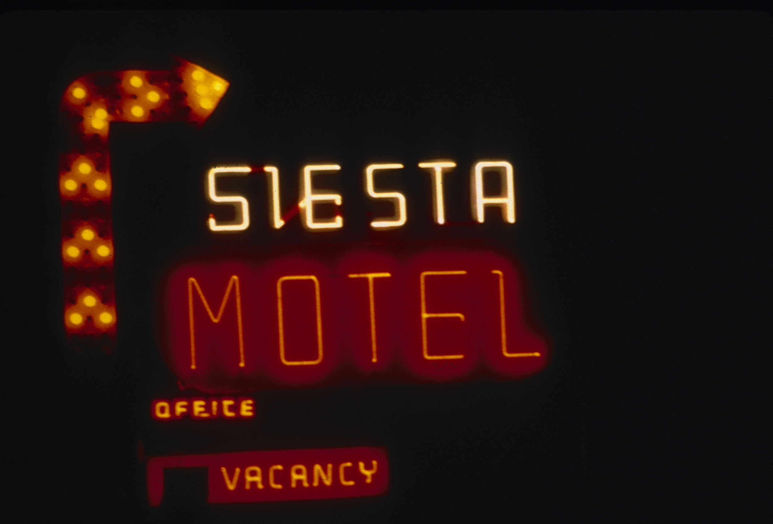 Slide of the neon sign for the Siesta Motel at night, Reno, Nevada, 1986