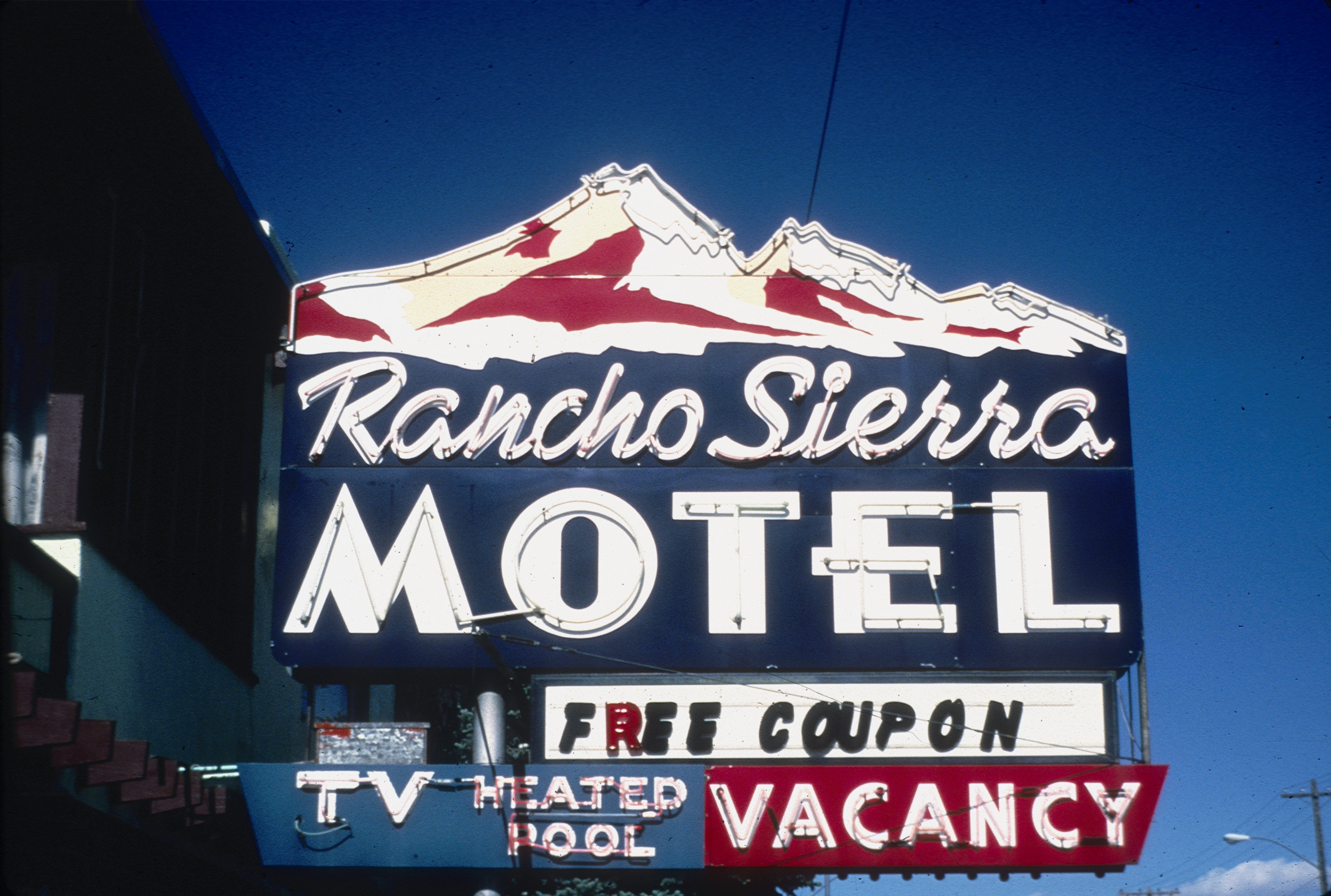Slide of the neon sign for the Rancho Sierra Motel, Reno, Nevada, 1986