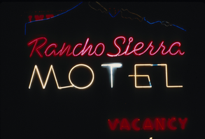 Slide of the neon sign for Rancho Sierra Motel at night, Reno, Nevada, 1986