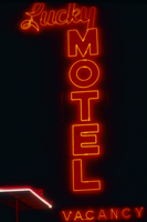 Slide of the neon sign for the Lucky Motel at night, Reno, Nevada, 1986